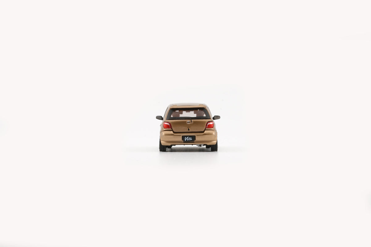BM Creation 1:64 Toyota 1998 Echo / Vitz 5 Doors - Golden 64B0370