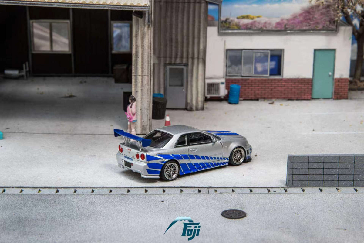 [Preorder] Fuji 1:64 Nissan Skyline GT-R R34 Nismo Z-Tune Silver Blue Livery (3 Variants)