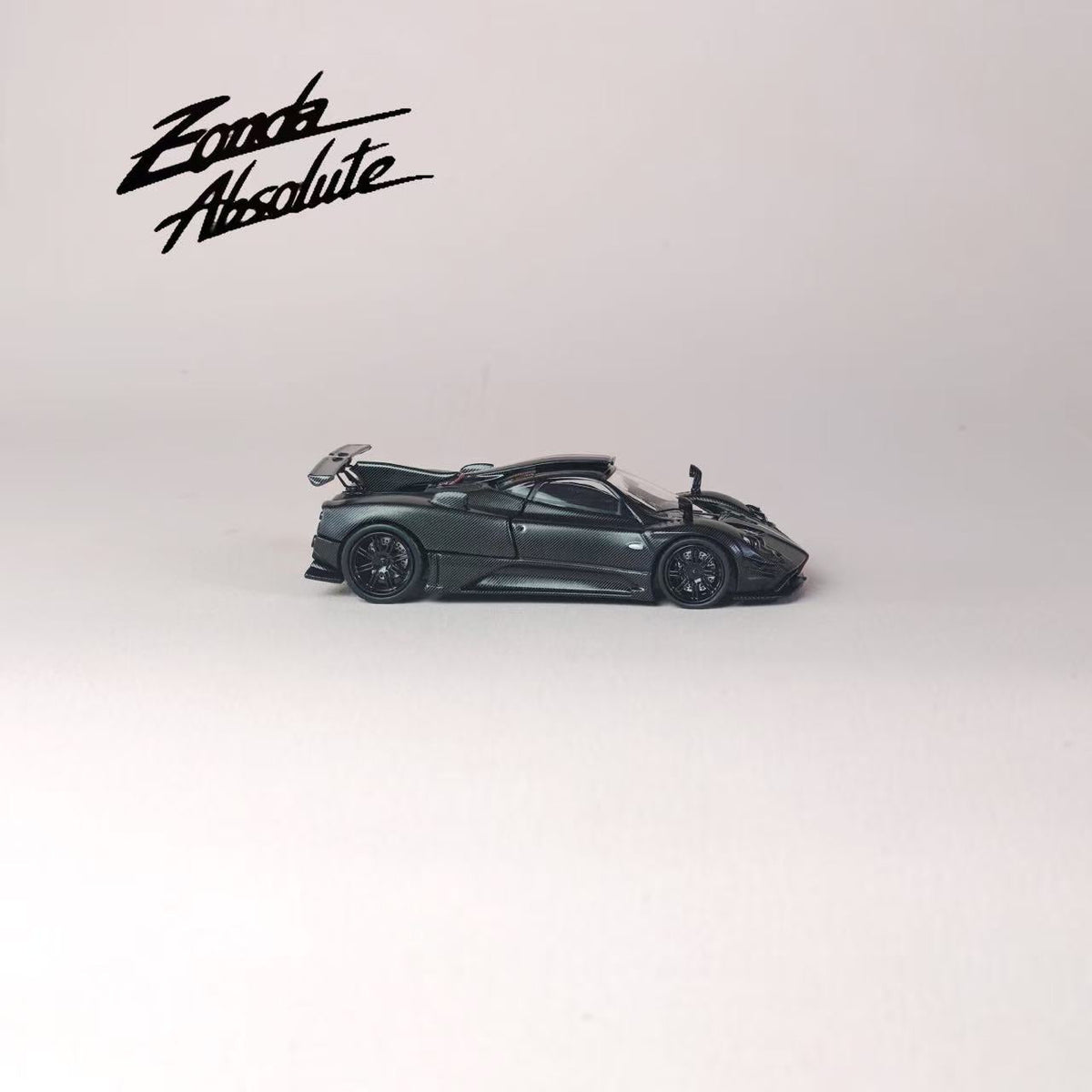[Preorder] Rhino Model 1:64 Pagani One-off Series. Zonda AbsoIute EVO #76061 (Full Black Matte Carbon Fiber With Italian Tricolor Stripes)