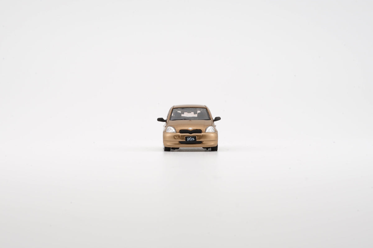 BM Creation 1:64 Toyota 1998 Echo / Vitz 5 Doors - Golden 64B0370